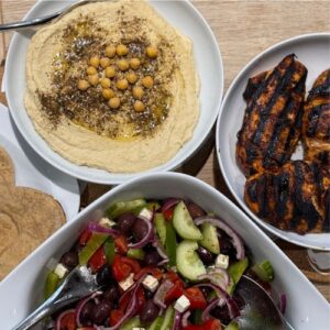 Shawarma chicken served with greek salad, pittas and hummus