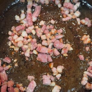 Slow cooked beef shin with red wine, baby carrots & onions