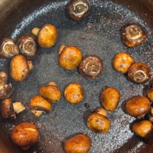 Slow cooked beef shin with red wine, baby carrots & onions